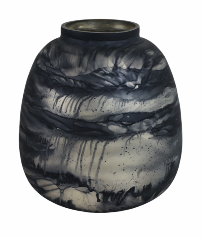 Black blue and grey rounded glass vase on a white background. 