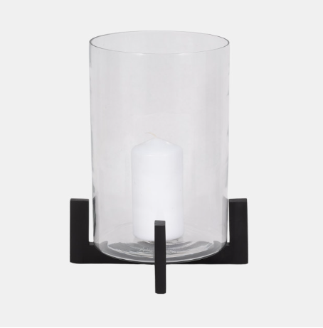 A modern style hurricane candle lantern with a clear glass cylinder and a black metal base.
