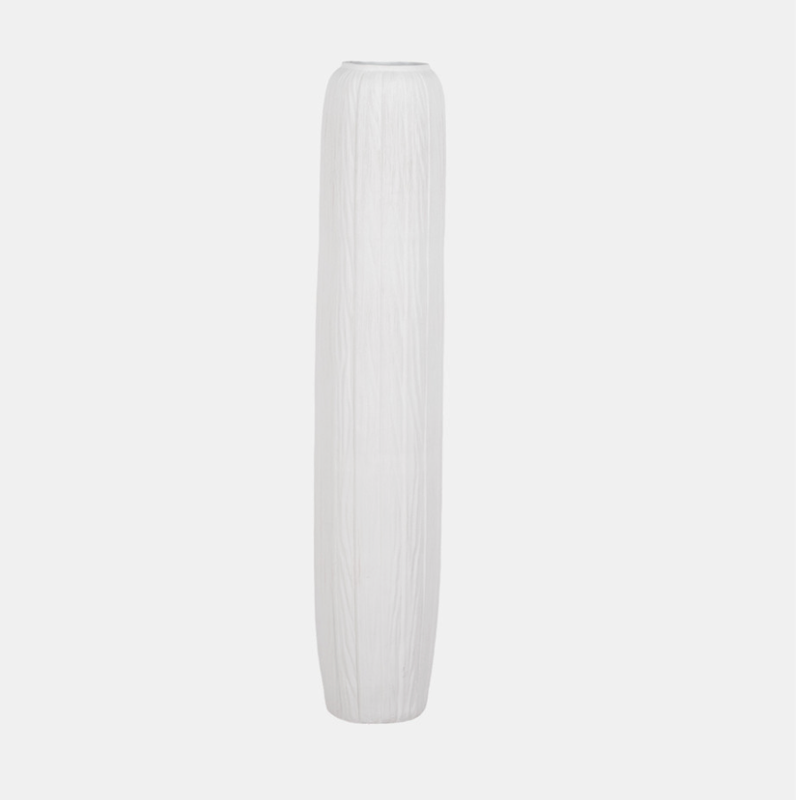 White vase with ribbed texture on a light gray background