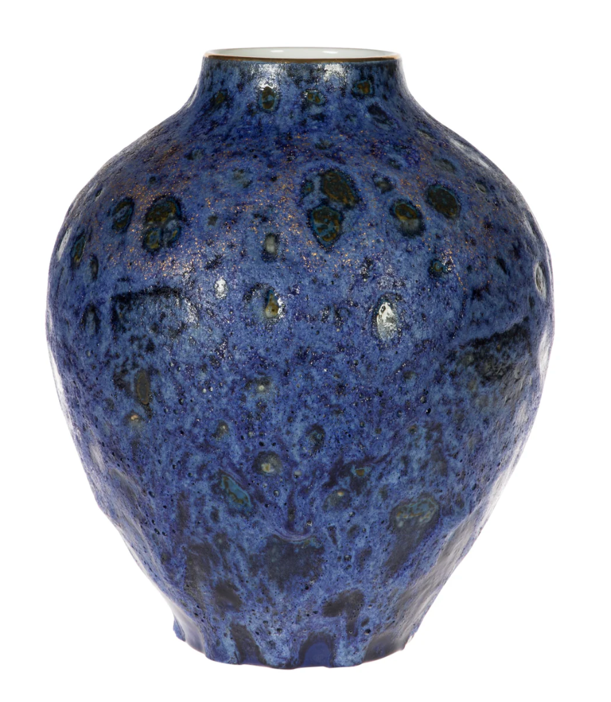 Blue ceramic vase with a textured surface on a white background
