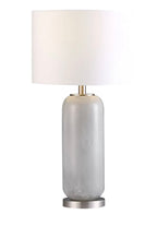 A silver cylindrical table lamp with a white shade, featuring a metallic base and a round white top.