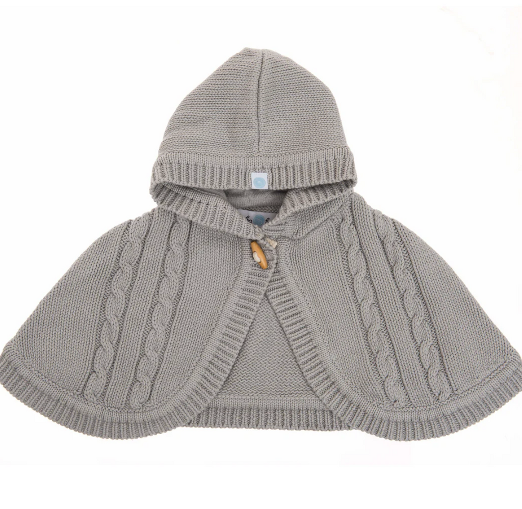 Gray knitted poncho with hood on a white background