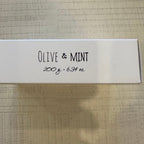 A white Belle De Provence - Olive & Mint box with the text 'OLIVE & MINT' printed on it, along with '200 g - 6.35 oz' and the dimensions '6.
