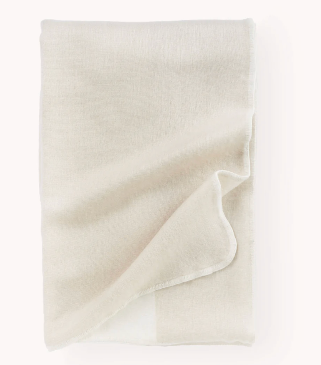 Buttercream alpaca blend blanket on a white background.