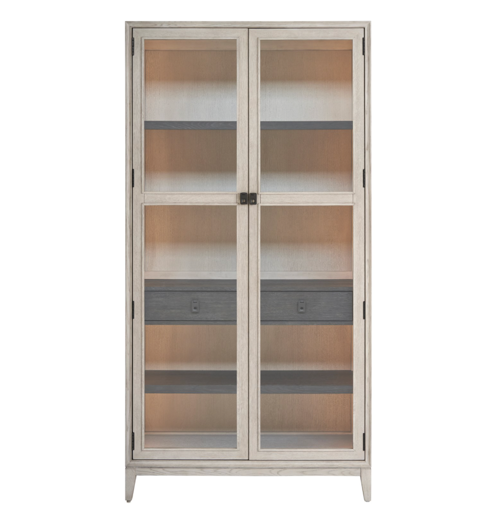 Light wash wooden cabinet with glass doors, 4 interior shelves and one drawer. 