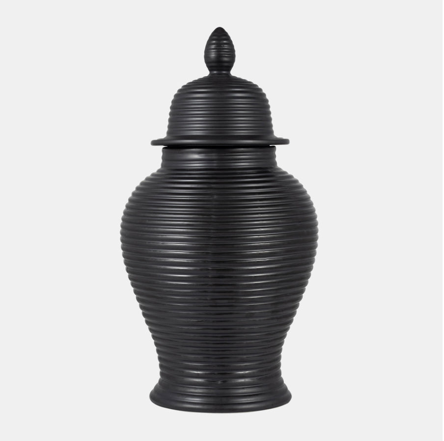 Black ribbed urn with lid on a white background. 