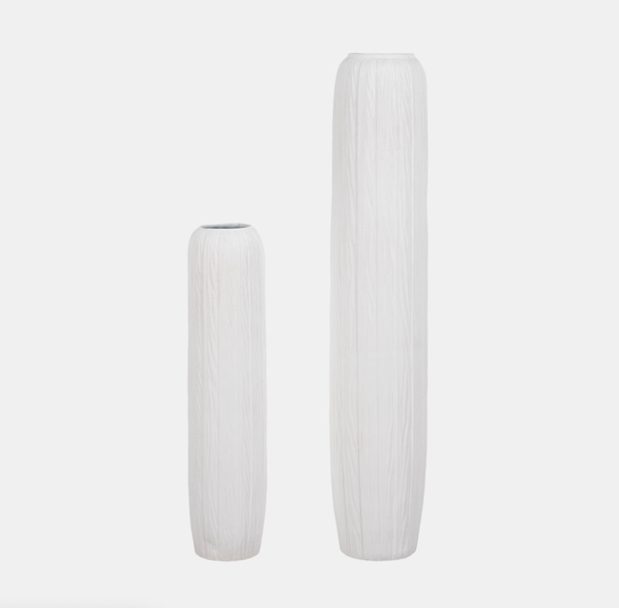 Two white textured vases on a light gray background