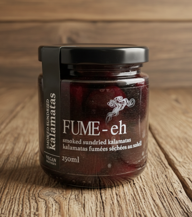 Jar of smoked sundried kalamata olives with 'FUME-eh' branding on a white background