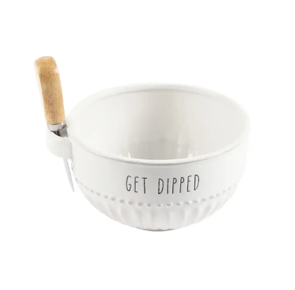 White porcelain dip bowl with wooden handled spreading utensil attached to the side. 