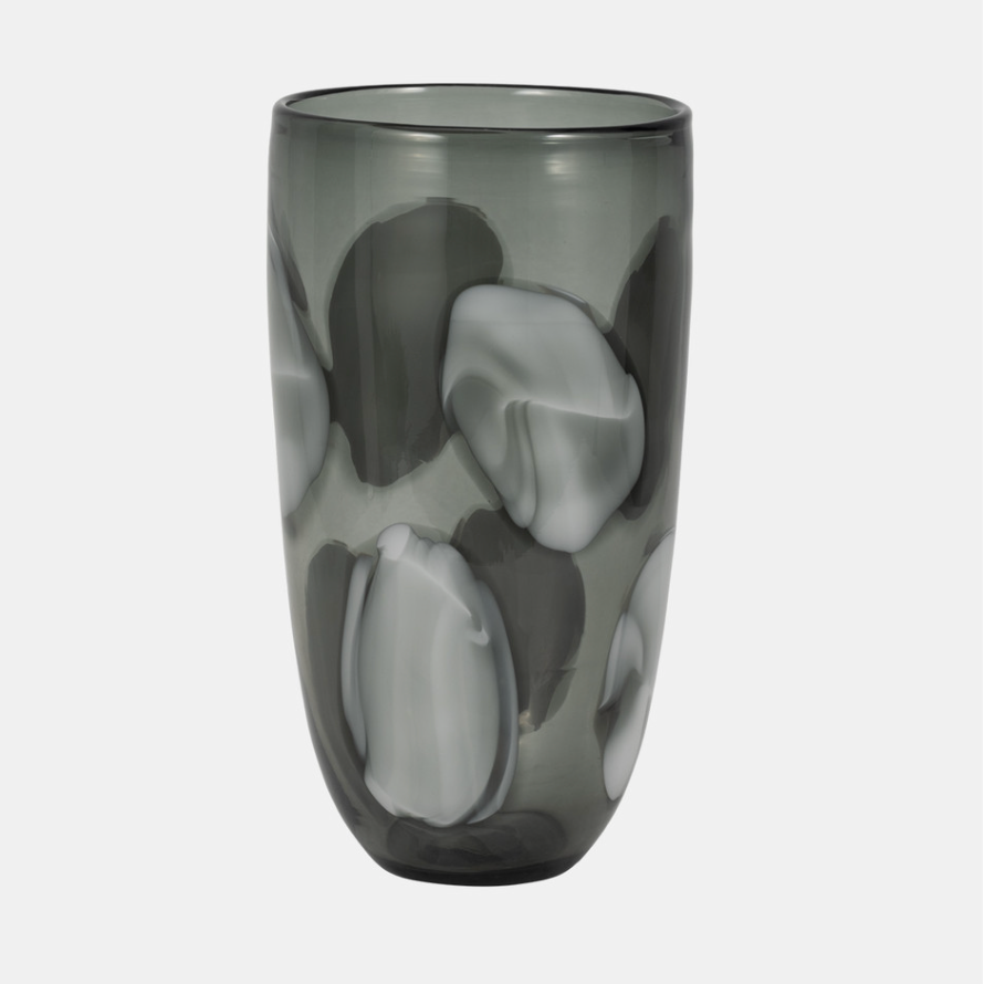 An 11 inch hand blown glass vase with a camouflage pattern in shades of gray and blue.
