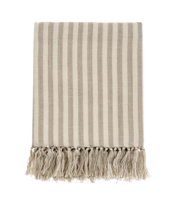 Beige striped Hammam towel with fringes on a white background