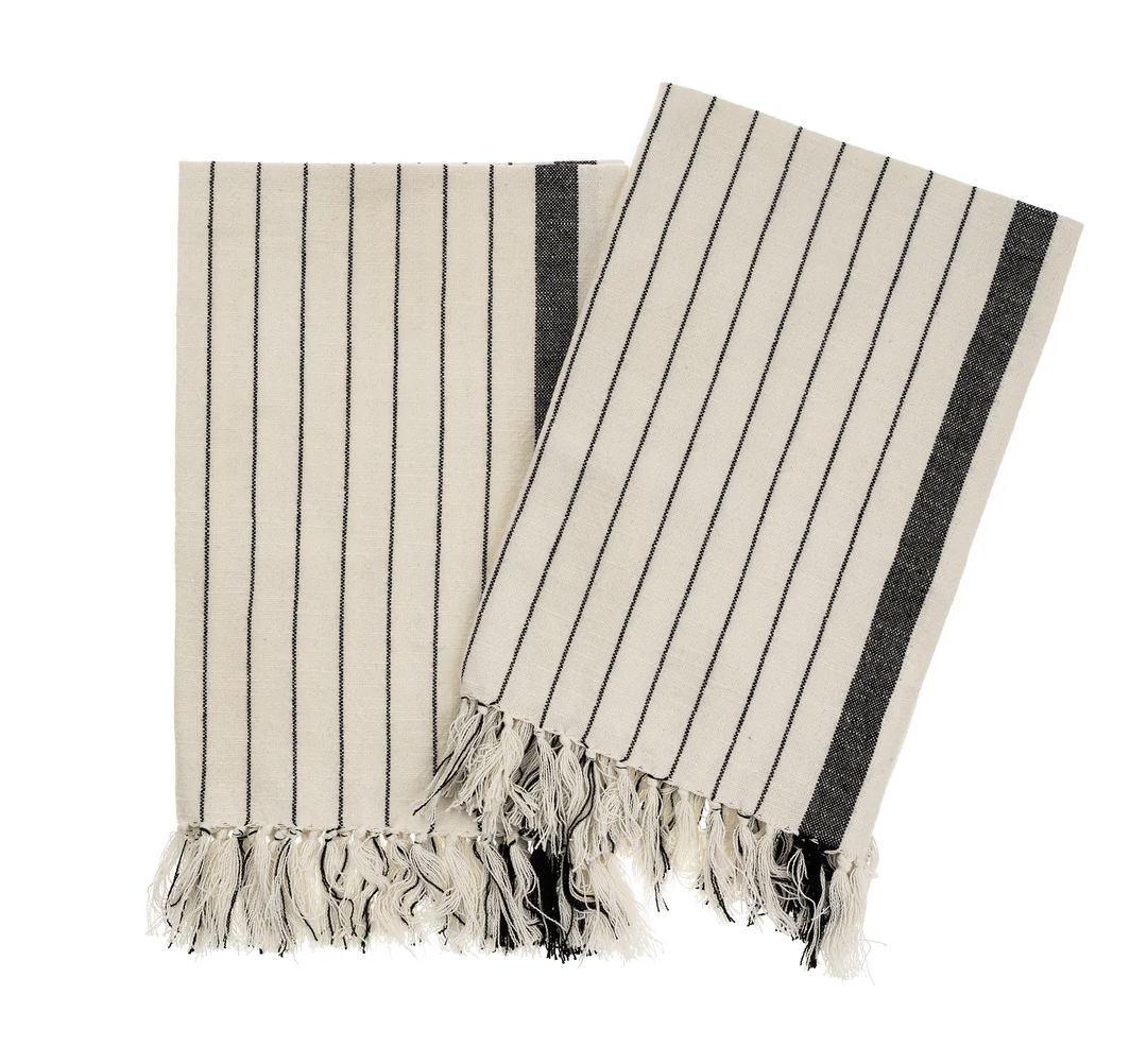 Two striped Hammam towels with fringes on a white background
