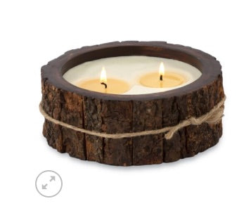 Mango wood tree bark candle with two wicks on a white background. 