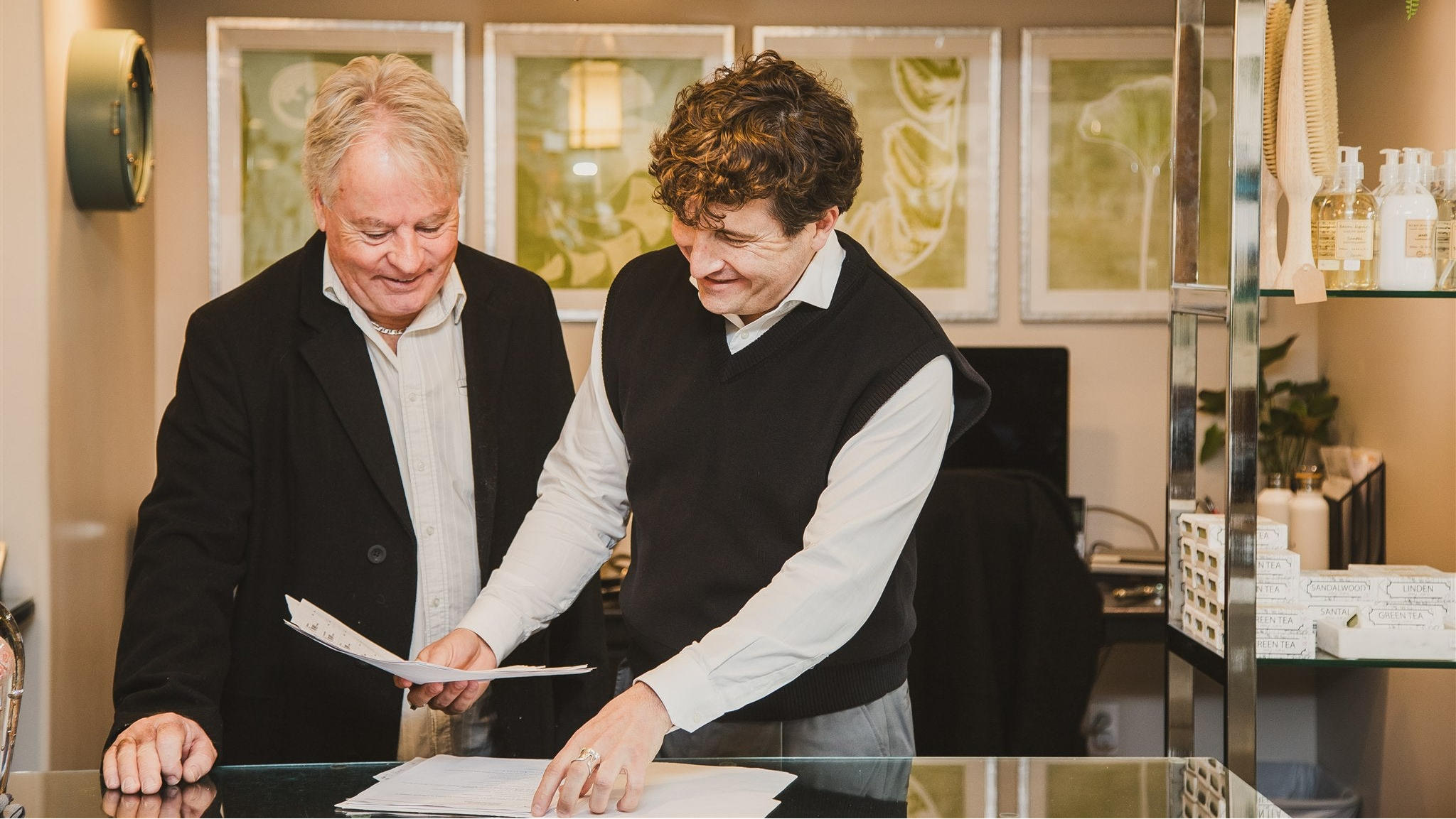 Two men reviewing documents in the Home By Design Wiarton store.
