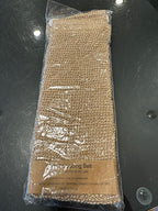 A beige jute scrubbing belt wrapped in plastic packaging with a label that includes the text 'Jute Scrubbing Belt' and the brand name 'Lothantique'.