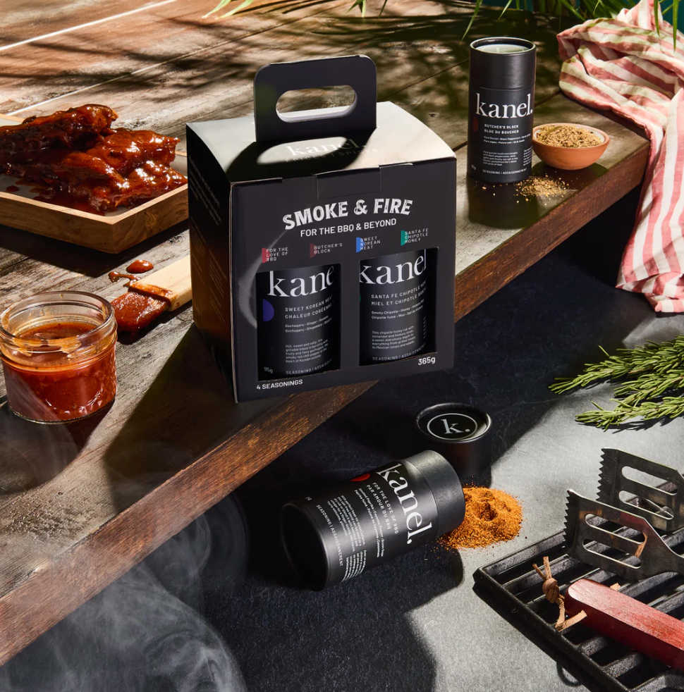 Kanel products on a grill with smoked meats and seasonings