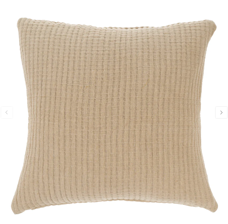 Beige or Chambray square-shaped cushion with a textured fabric. 