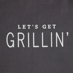 Close-up of the Let's Get Grillin' Apron showing the text "LET'S GET GRILLIN'" embroidered on grey material. 
