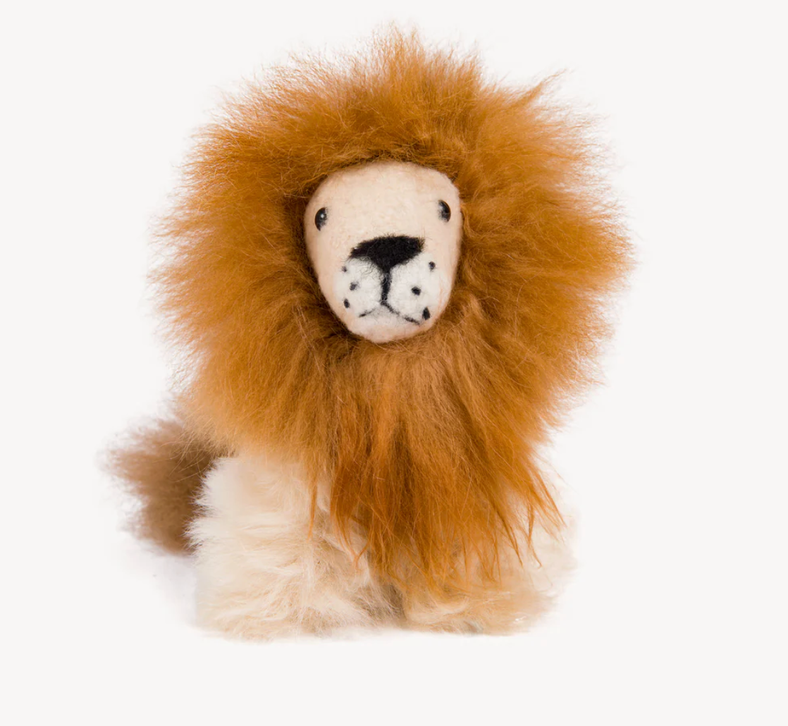 Stuffed lion toy with a fluffy mane on a white background