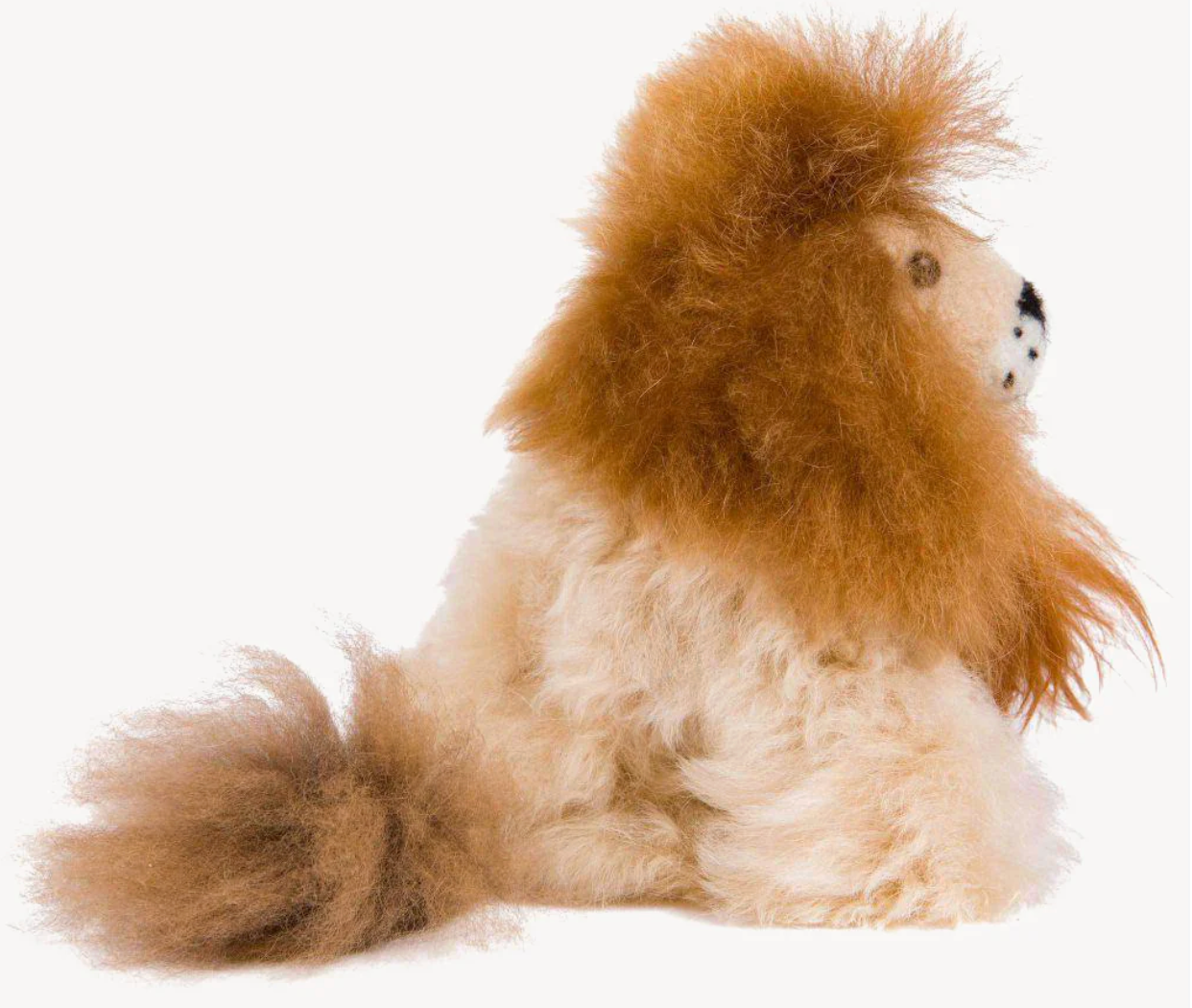 Stuffed lion toy with a fluffy mane and fur on a white background