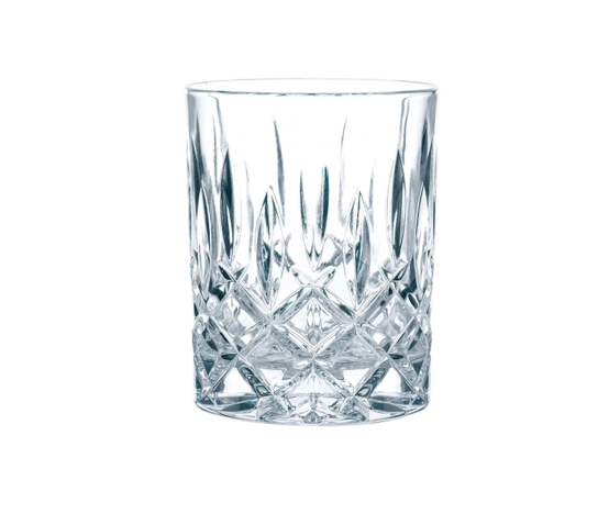 A clear crystal whiskey tumbler with a geometric cut pattern.