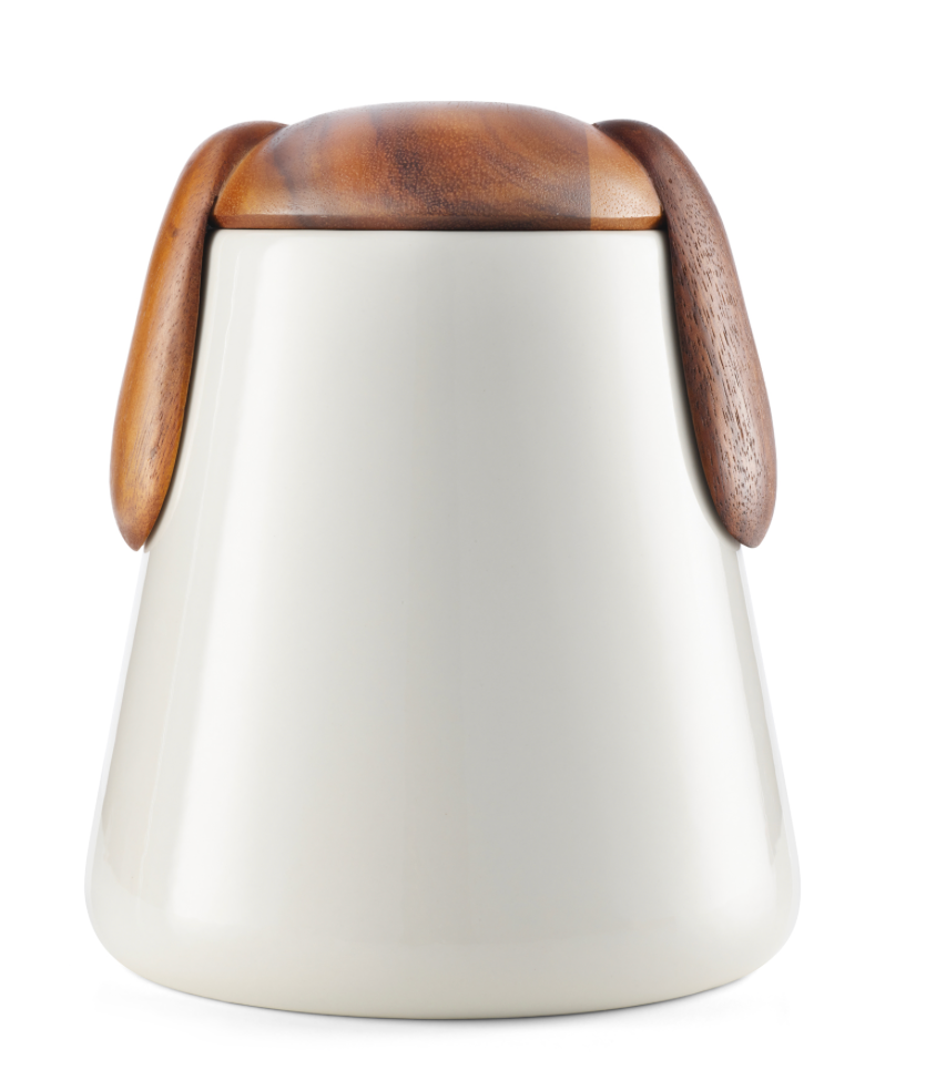 Cream ceramic dog treat cannister with acacia wood lid with dog ears embellishment. 
