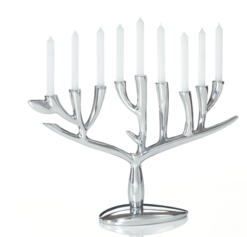 A silver-colored Nambe alloy menorah with a Tree of Life design, featuring eight candles.