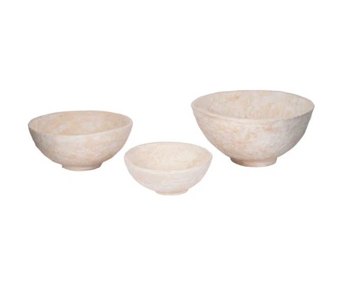 A set of three beige paper maché bowls in different sizes placed against a white background.