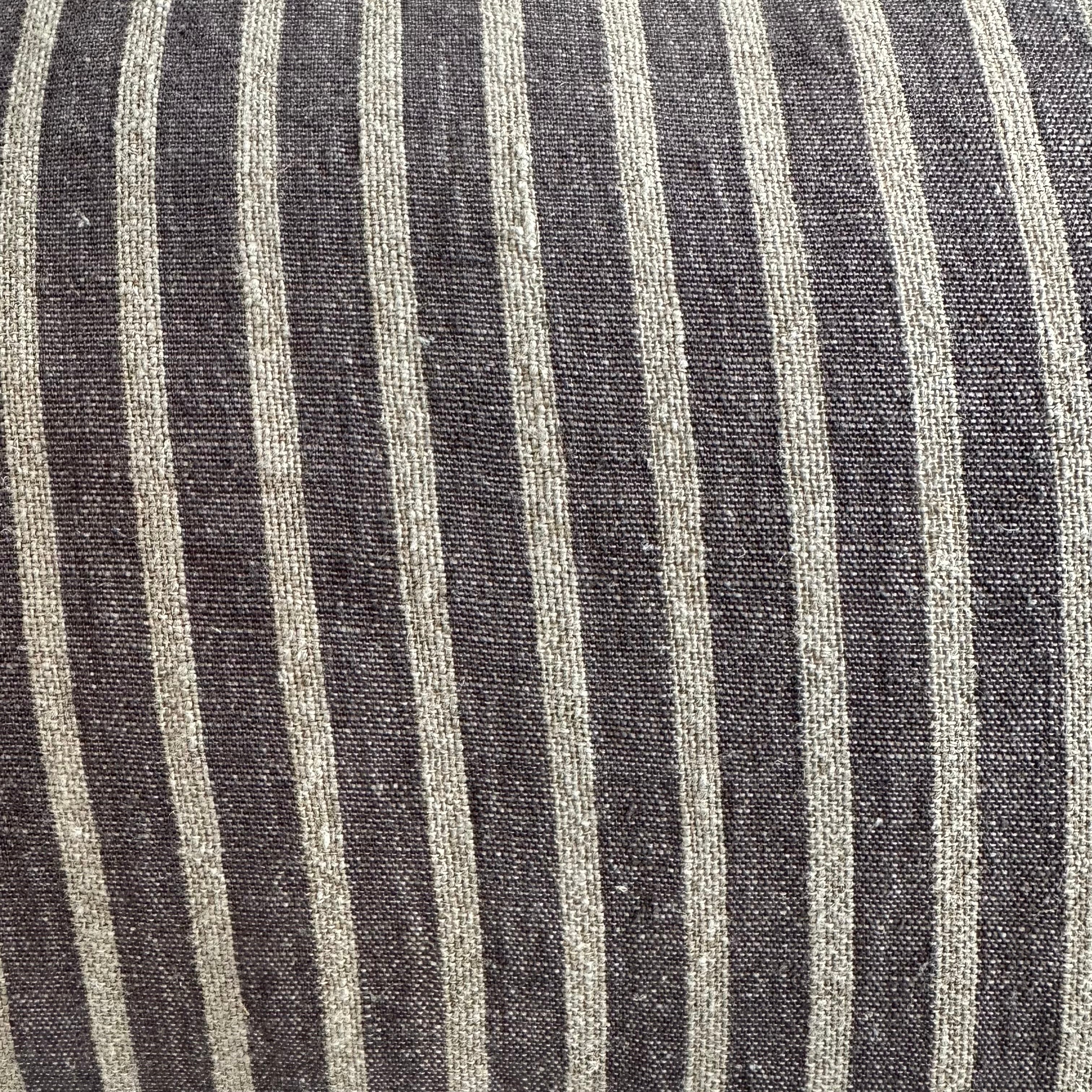 Close-up of black and white striped fabric cushion