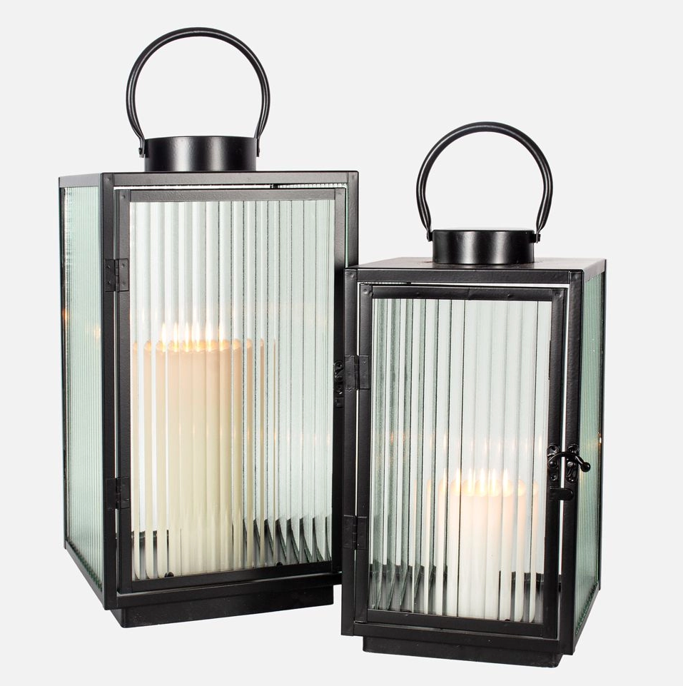 Two black square lanterns with fluted glass panels, suitable for candle lighting, on a white background.