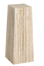 Rectangular travertine pedestal on a white background