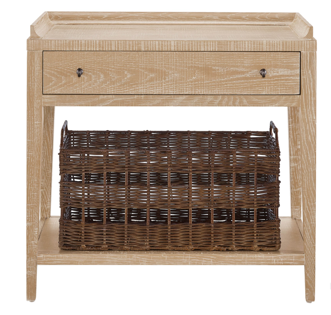 A rustic oak night stand with a drawer and basket storage on the bottom shelf. 