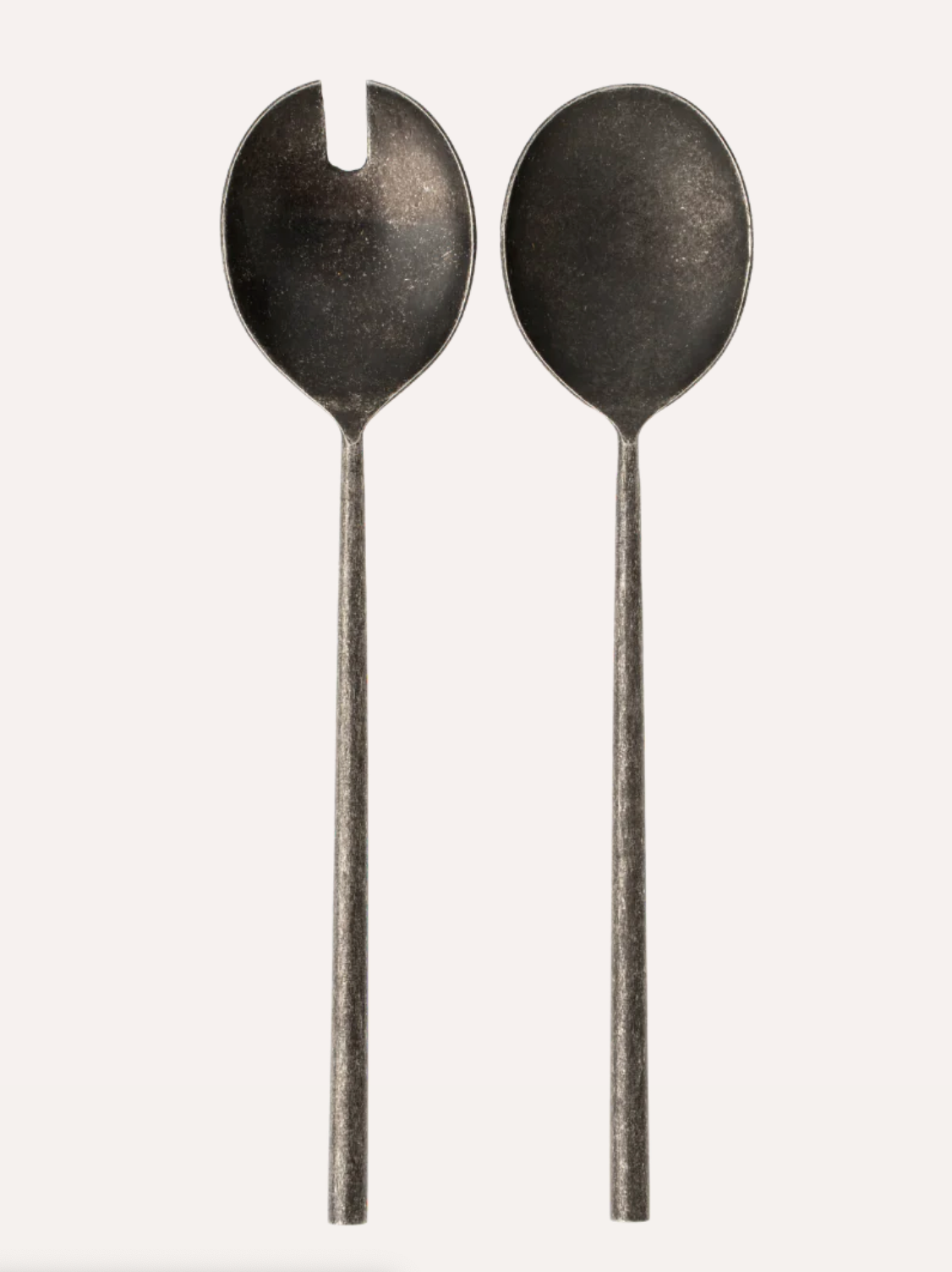 A pair of hand-forged stainless steel salad servers with a distressed matte silver finish.