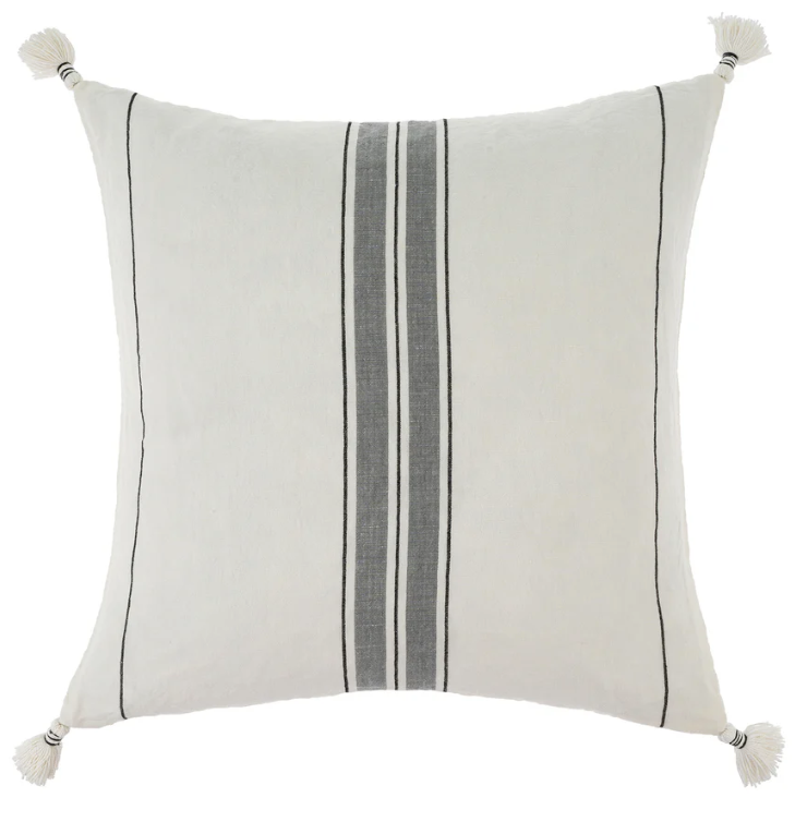 A square-shaped cushion with a striped pattern, primarily in white and gray, with tassels on the corners.