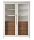 White cabinet with glass doors and wooden drawers on a white background