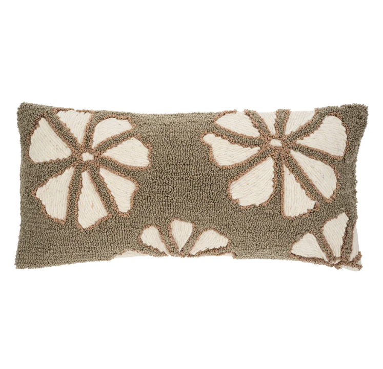 A rectangular-shaped throw pillow with a geometric pattern featuring flower-like shapes in beige and brown tones on a light background.