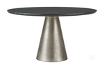 A round dining table with a slate marble tabletop and metallic base.