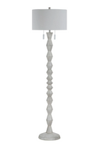 White floor lamp with a white shade on a white background