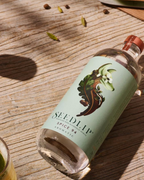 Seedlip Spice 94 bottle on a wooden surface