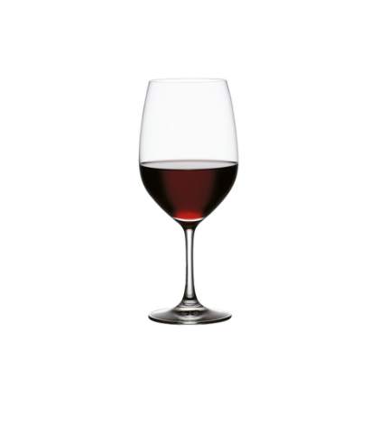A clear crystal wine glass filled with red wine, standing upright on a surface with a blurred background.