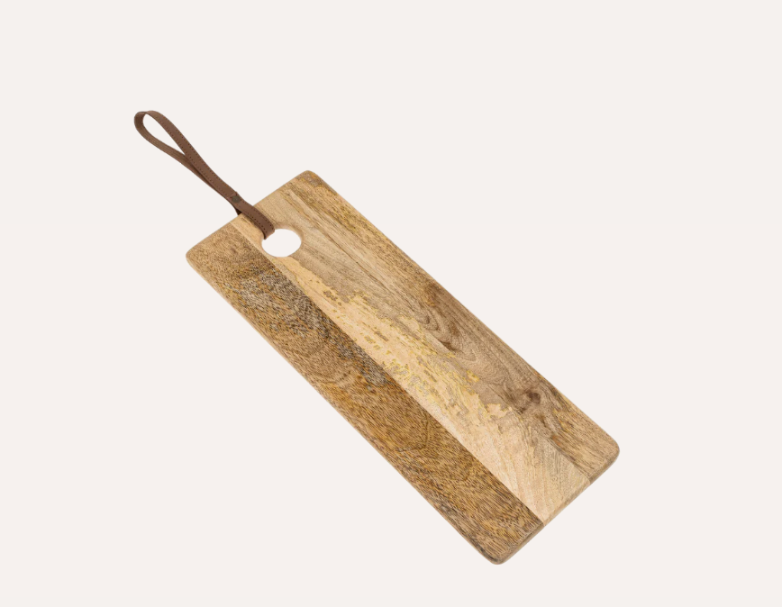 A rectangular-shaped mango wood butcher's board with a leather strap handle, displaying natural wood grain and color variations.