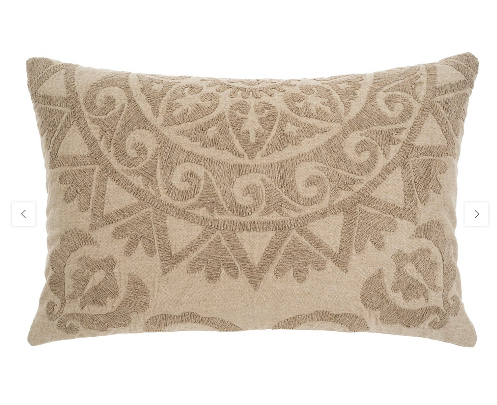 A rectangular Suzani boucle pillow in beige color with a geometric pattern.