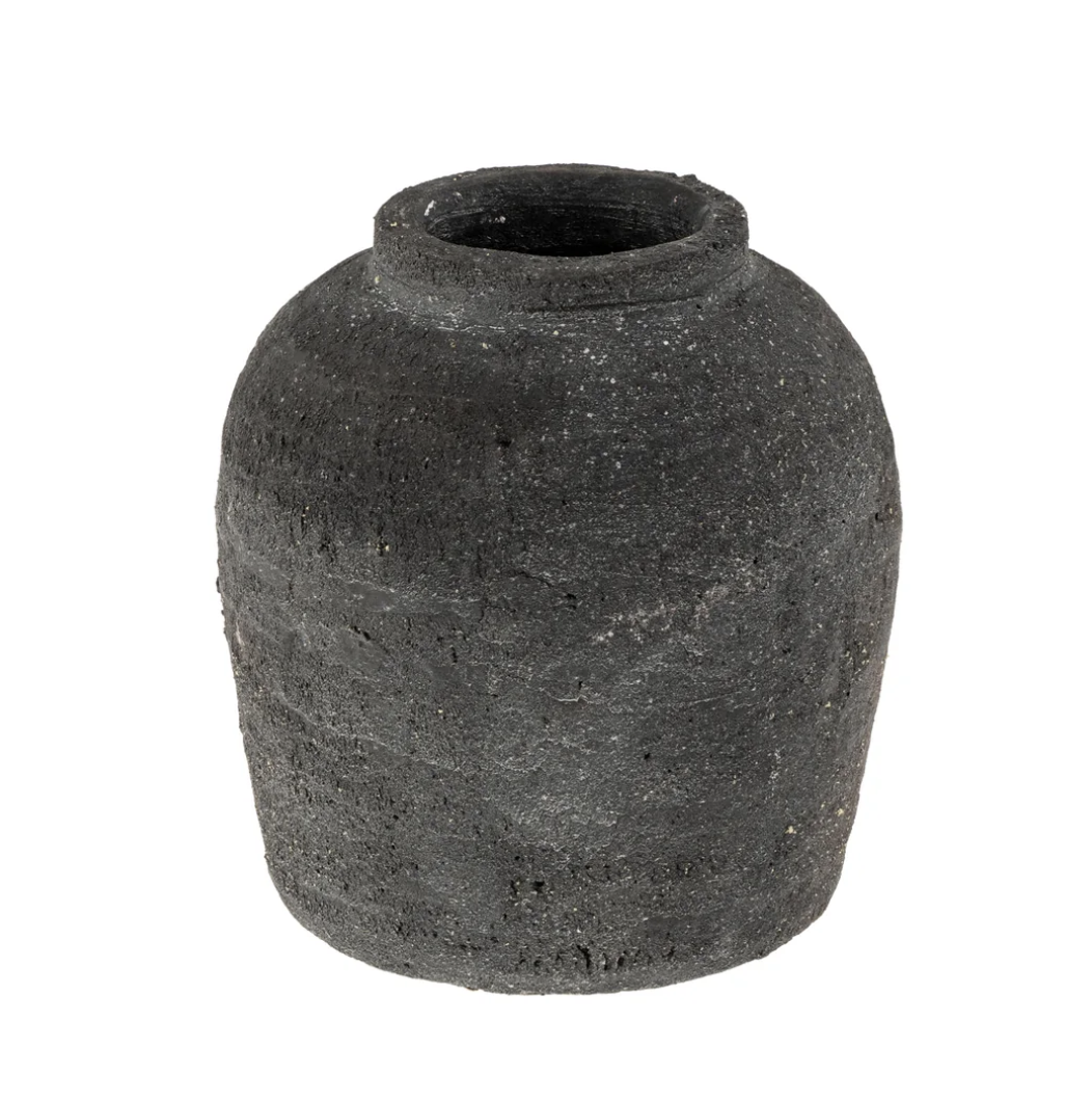 Black terracotta stone vase on a white background