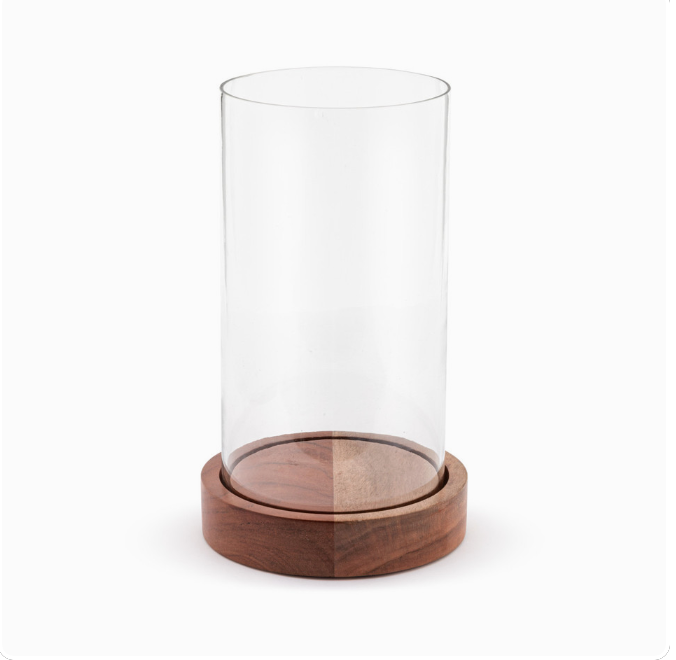 A large cylindrical glass hurricane with a wooden base and lid.