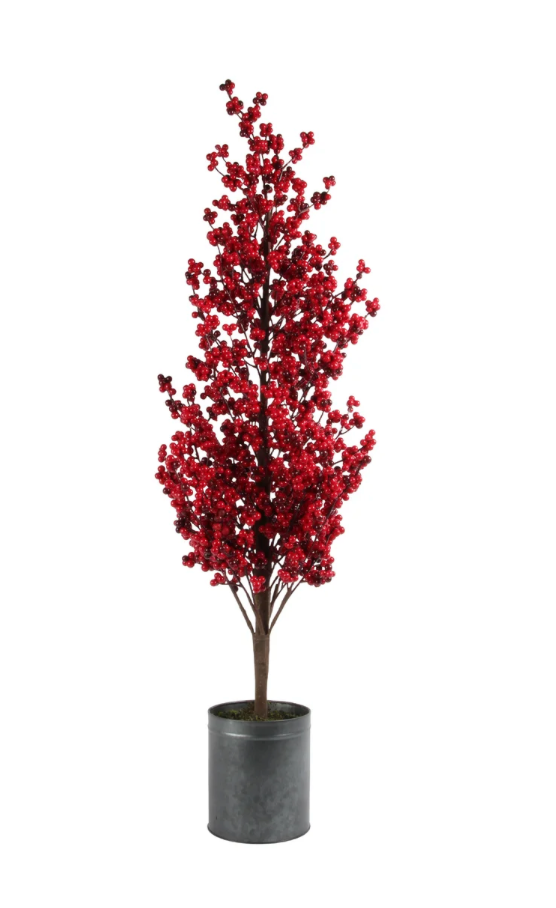 Potted artificial tree with red berries on a white background